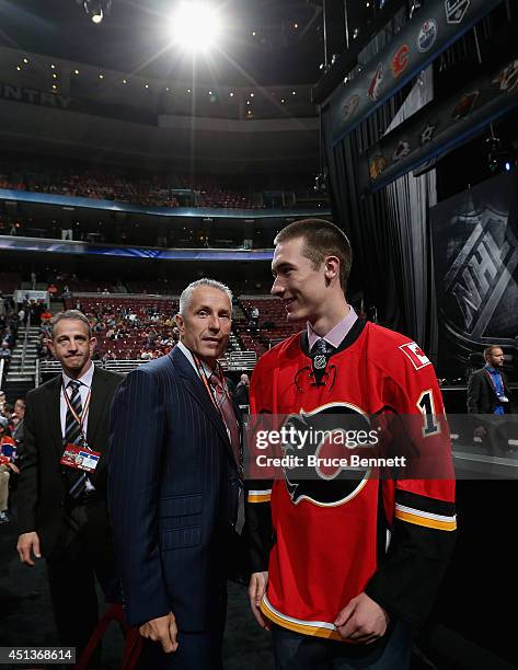 Mason McDonald meets his team after being drafted by the Calgary Flames on Day Two of the 2014 NHL Draft at the Wells Fargo Center on June 28, 2014...