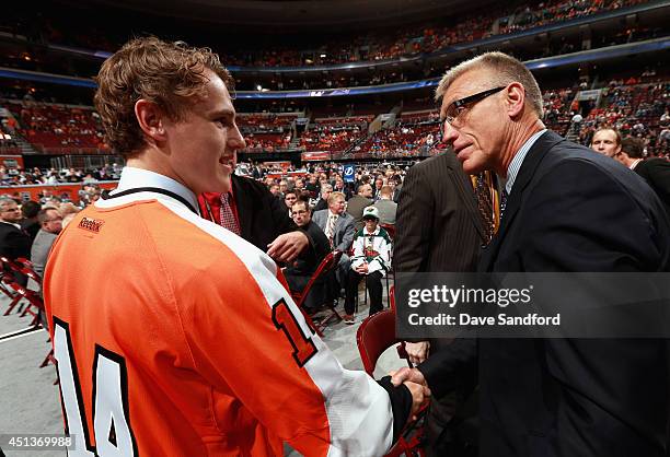 Nicolas Aube-Kubel is greeted by President Paul Holmgren after being selected 48th overall by the Philadelphia Flyers during the 2014 NHL Entry Draft...