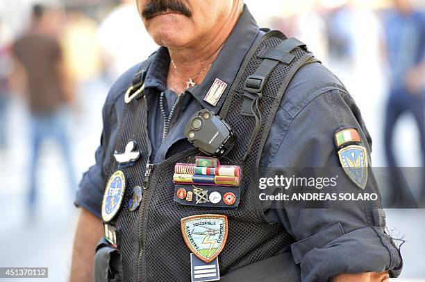 Policeman wears a "body cam" during a demonstration of Italian far-left unions and mouvements against the government of Matteo Renzi on June 28, 2014...