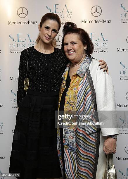 Olivia Firth and International New York Times International Fashion Editor, Suzy Menkes arrive at the Flower Dome on November 20, 2013 in Singapore....