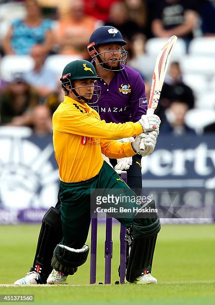 James Taylor of Nottinghamshire hits out ahead of Jonny Bairstow of Yorkshire during the Natwest T20 Blast match between Nottinghamshire Outlaws and...