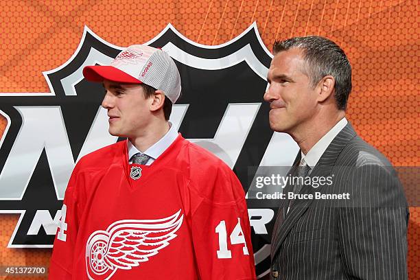 Dominic Turgeon with his father Pierre Turgeon after being drafted by the Detroit Red Wings on Day Two of the 2014 NHL Draft at the Wells Fargo...