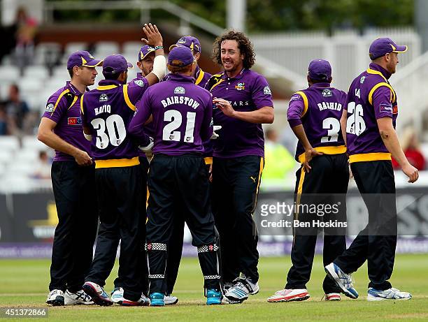 Ryan Sidebottom of Yorkshire celebrates with team mates after taking a wicket during the Natwest T20 Blast match between Nottinghamshire Outlaws and...