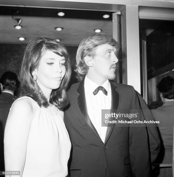 Actor David Hemmings with actress Anjanette Comer arrive at a party in Los Angeles,California.