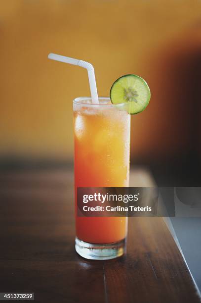 a bright orange drink - sanur bildbanksfoton och bilder