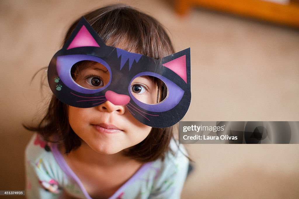 Girl wearing cat mask