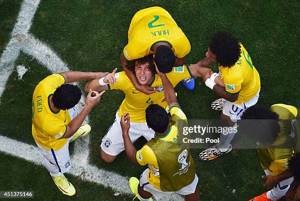 David Luiz of Brazil celebrates scoring his team's first goal with teammates during the 2014 FIFA World Cup Brazil round of 16 match between Brazil...