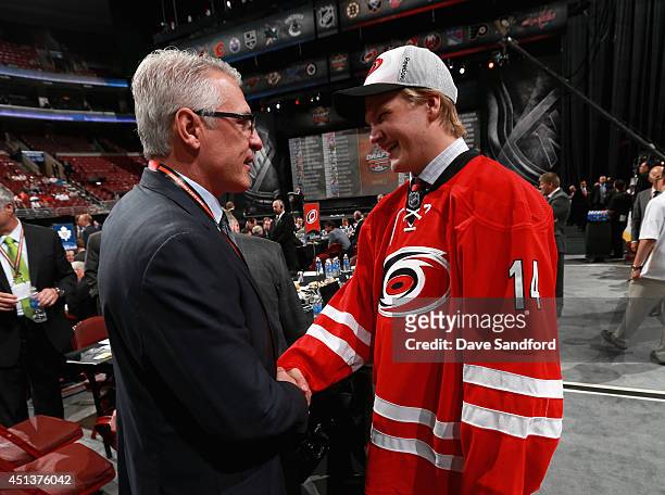 General Manager Ron Francis congratulates Josh Wesley after he was selected 96th overall by the Carolina Hurricanes during the 2014 NHL Entry Draft...
