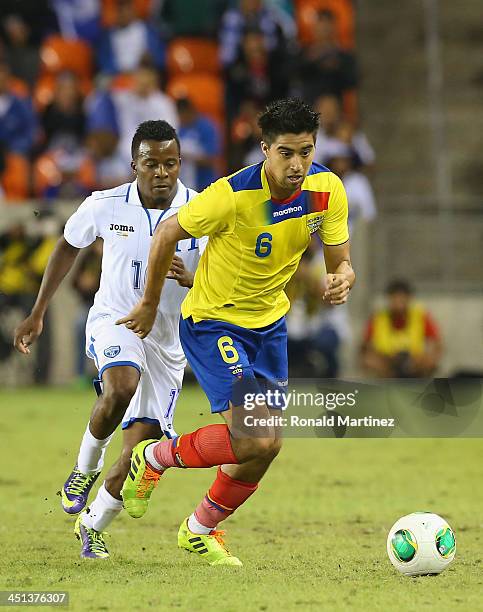 Marvin Chavez of Honduras and Christian Noboa of Ecuador during an international friendly match at BBVA Compass Stadium on November 19, 2013 in...