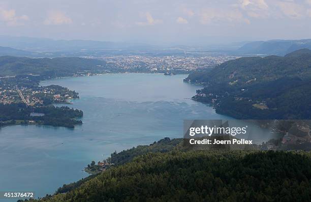 General view of the Worthersee lake with the towns of Poertschach and Klagenfurt in the Carinthia region ahead of the 2014 Ironman Austria on June...