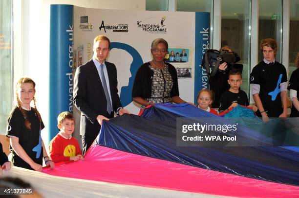 Prince William, Duke of Cambridge holds up a parachute at the Haven Point leisure centre after attending a Diana Award Inspire Day training workshop...