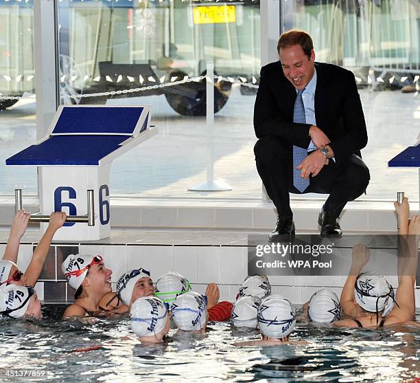 Prince William, Duke of Cambridge speaks to swimmers at the Haven Point leisure centre after attending a Diana Award Inspire Day training workshop...