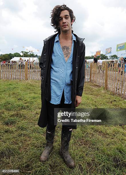 Matthew Healy of The 1975 attends the backstage compound of Glastonbury Festival at Worthy Farm on June 27, 2014 in Glastonbury, England.