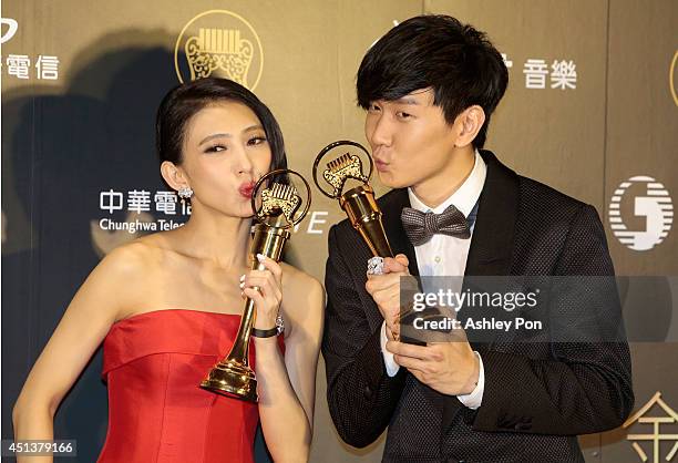 Taiwanese singer Penny Tai and Singapore singer JJ Lin pose for a photograph after receiving their awards of Best Mandarin Female Singer and Best...