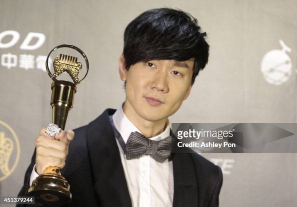 Singapore singer JJ Lin holds his award for Best Male Mandarin singer ...