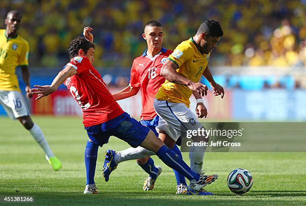 Eugenio Mena of Chile challenges Hulk of Brazil during the 2014 FIFA World Cup Brazil round of 16 match between Brazil and Chile at Estadio Mineirao...