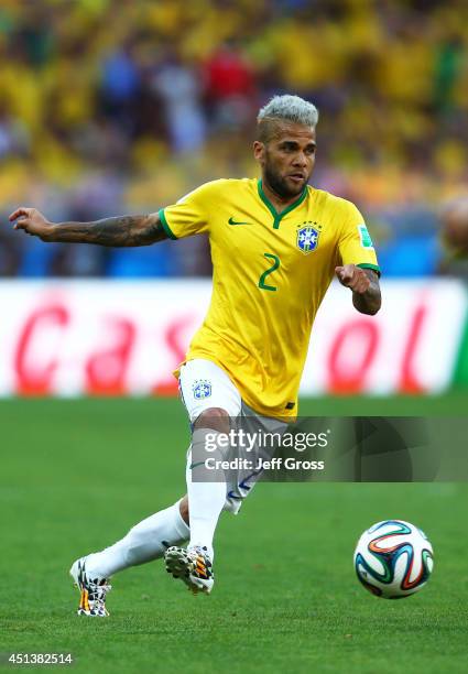 Dani Alves of Brazil controls the ball during the 2014 FIFA World Cup Brazil round of 16 match between Brazil and Chile at Estadio Mineirao on June...