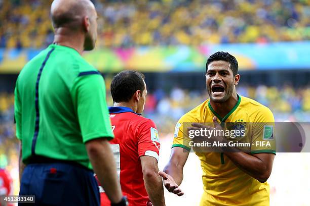 Hulk of Brazil appeals to assistant referee Michael Mullarkey for the disallowed goal due to hand ball during the 2014 FIFA World Cup Brazil Round of...