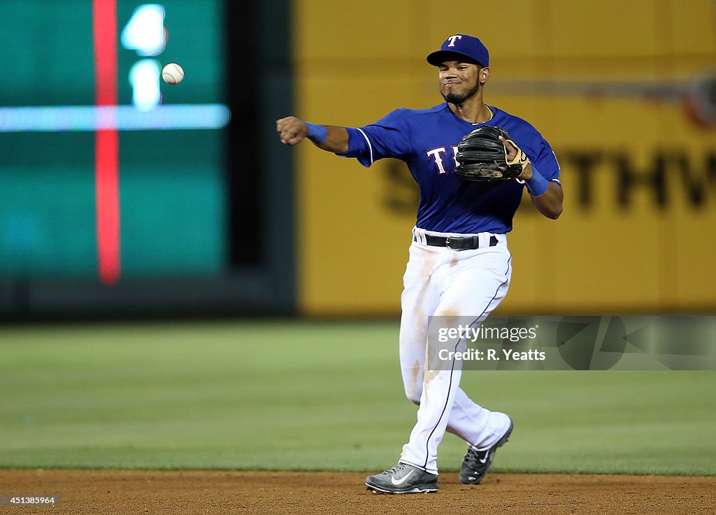 Luis Sardinas of the Texas Rangers throws to first base in the ninth ...