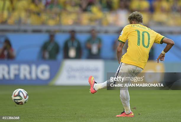 Brazil's forward Neymar kicks the ball during the penalty shoot out after extra-time in the Round of 16 football match between Brazil and Chile at...