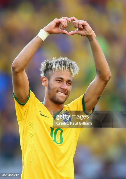 Neymar of Brazil celebrates victory after the penalty shootout against Chile in the 2014 FIFA World Cup Brazil round of 16 match between Brazil and...