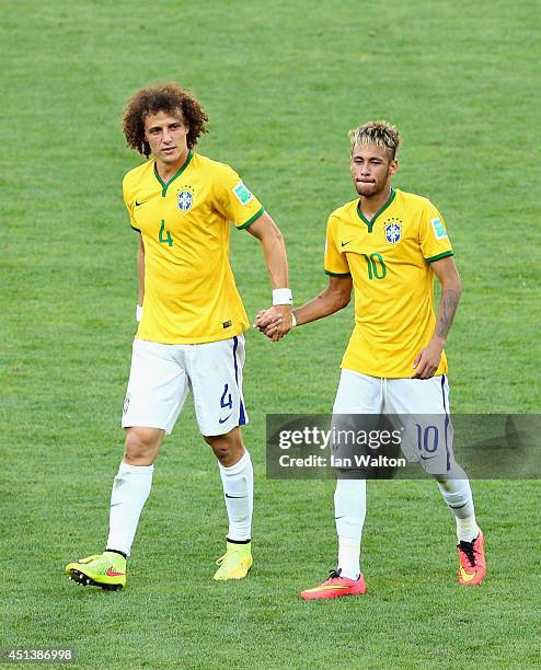 David Luiz and Neymar of Brazil celebrate after defeating Chile in a penalty shootout during the 2014 FIFA World Cup Brazil round of 16 match between...