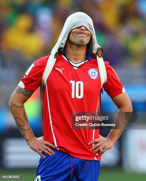 Jorge Valdivia of Chile reacts after being defeated by Brazil in a penalty shootout during the 2014 FIFA World Cup Brazil round of 16 match between...