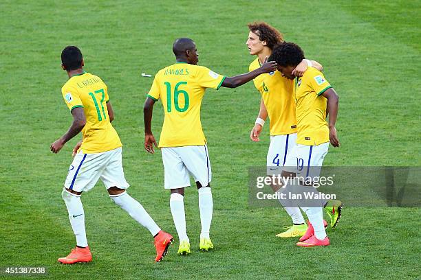 Willian is consoled by Ramires and David Luiz of Brazil after missing a penalty kick in the shootout during the 2014 FIFA World Cup Brazil round of...