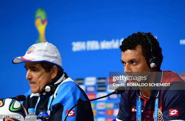Costa Rica's midfielder Michael Barrantes speaks next to Costa Rica's Colombian coach Jorge Luis Pinto during a press conference at the Pernambuco...