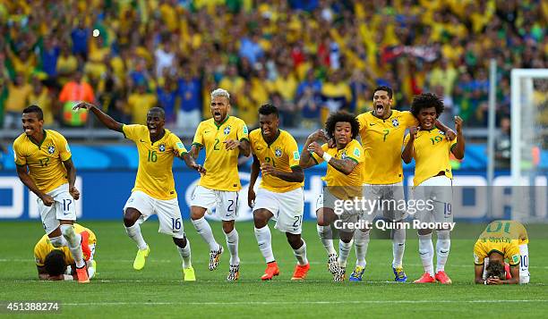 Thiago Silva, Luiz Gustavo, Ramires, Dani Alves, Jo, Marcelo, Hulk, Willian and Neymar of Brazil celebrate after defeating Chile in a penalty...