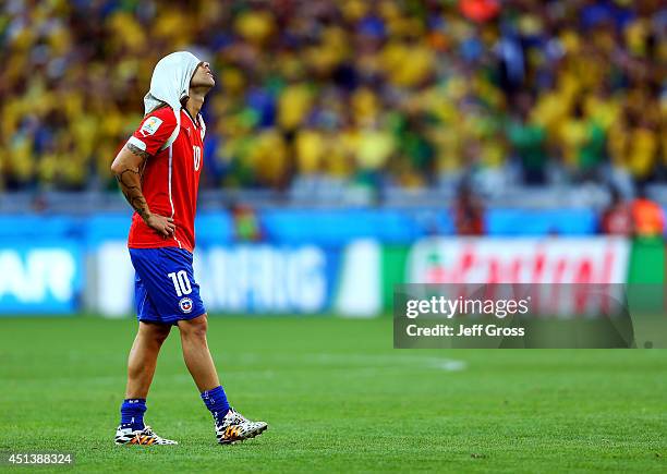 Jorge Valdivia of Chile reacts after being defeated by Brazil in a penalty shootout during the 2014 FIFA World Cup Brazil round of 16 match between...