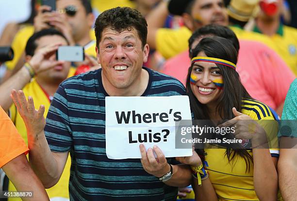 Colombian fans hold up a sign 'Where's Luis' in reference to the banned Luis Suarez ahead of the 2014 FIFA World Cup Brazil round of 16 match between...