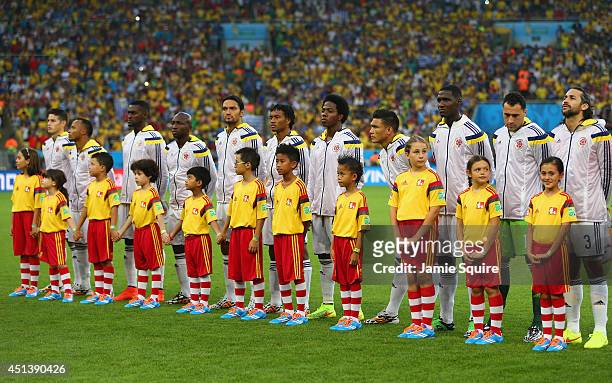 Colombia line up for the National Anthem prior to the 2014 FIFA World Cup Brazil round of 16 match between Colombia and Uruguay at Maracana on June...