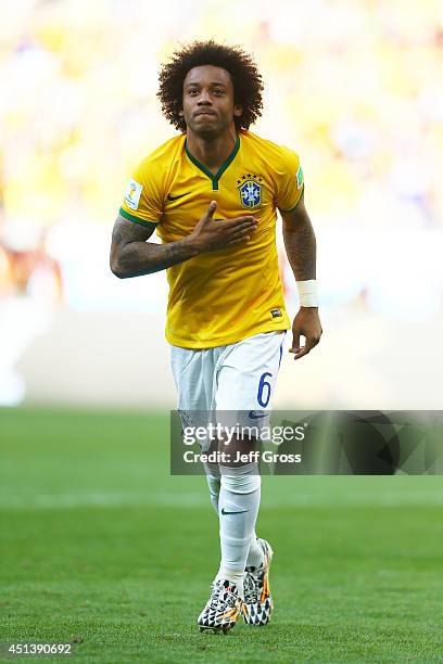 Marcelo of Brazil celebrates after defeating Chile in a penalty shootout during the 2014 FIFA World Cup Brazil round of 16 match between Brazil and...