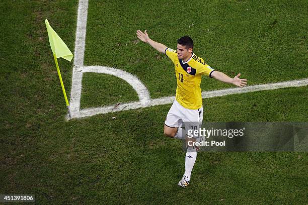 James Rodriguez of Colombia celebrates scoring his team's first goal during the 2014 FIFA World Cup Brazil round of 16 match between Colombia and...