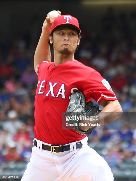 Yu Darvish of the Texas Rangers throws in the second inning against the Minnesota Twins at Globe Life Park in Arlington on June 28, 2014 in...