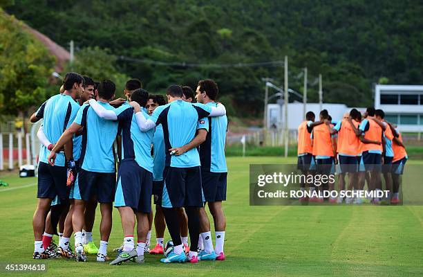 Costa Rica's players pray before a training session at the Wilson Campos training center in Recife on June 28 during the 2014 FIFA World Cup football...