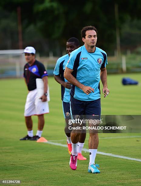 Costa Rica's defender Michael Umana warms up during a training session at the Wilson Campos training center in Recife on June 28 during the 2014 FIFA...