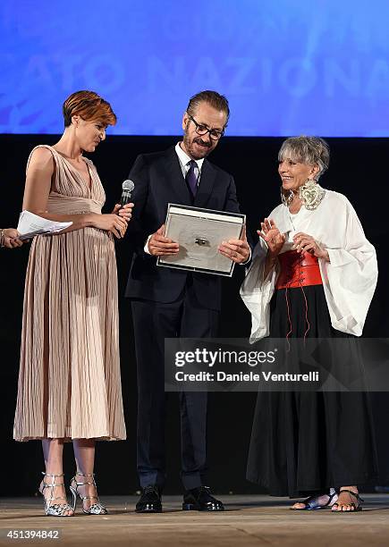 Marco Giallini receives the Nino Manfredi Award from Erminia Ferrari and Anna Foglietta during the Nastri D'Argento Awards Ceremony 2014 on June 28,...