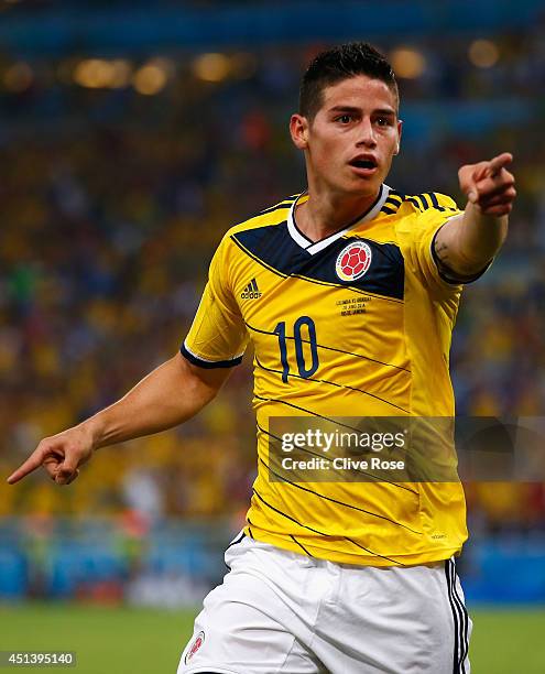 James Rodriguez of Colombia celebrates scoring his team's second goal and his second of the game during the 2014 FIFA World Cup Brazil round of 16...