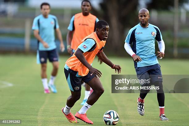 Costa Rica's forward Joel Campbell dribbles the ball during a training session at the Wilson Campos training center in Recife on June 28 a day before...
