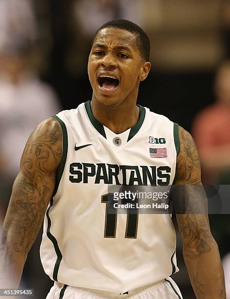 Keith Appling of the Michigan State Spartans looks down the court during the second half of the game against the Columbia Lions during the second...