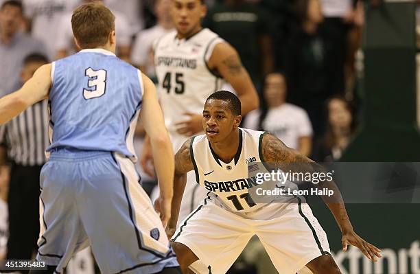 Keith Appling of the Michigan State Spartans defends against Grant Mullins of the Columbia Lions during the second half of the game at Breslin Center...