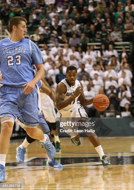 Keith Appling of the Michigan State Spartans brings the ball down the court during the second half of the game against the Columbia Lions during the...