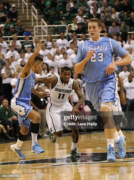 Keith Appling of the Michigan State Spartans brings the ball down the court during the second half of the game against the Columbia Lions during the...