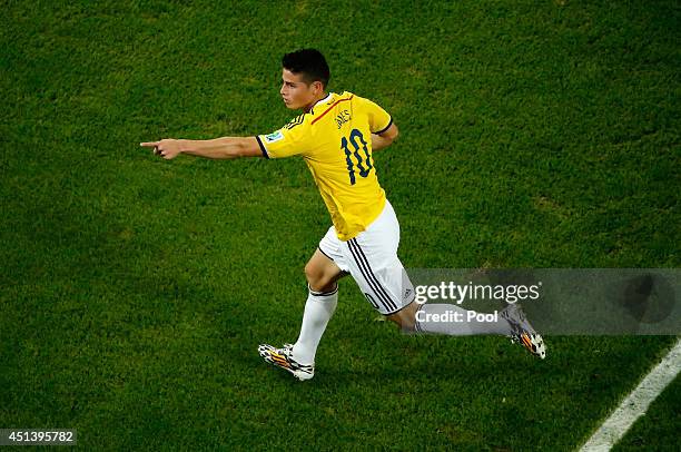 James Rodriguez of Colombia celebrates scoring his team's second goal and his second of the game during the 2014 FIFA World Cup Brazil round of 16...