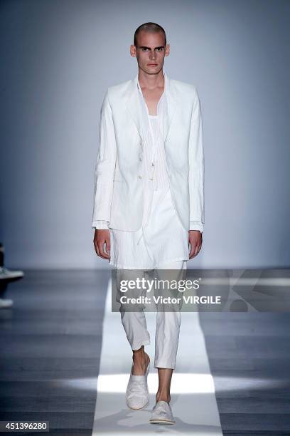 Model walks the runway during the Ann Demeulemeester show as part of the Paris Fashion Week Menswear Spring/Summer 2015 on June 27, 2014 in Paris,...