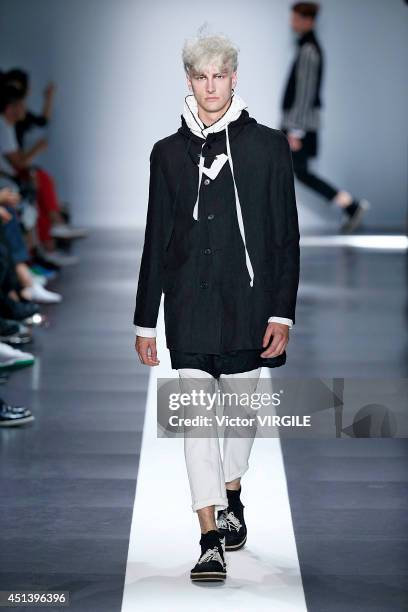 Model walks the runway during the Ann Demeulemeester show as part of the Paris Fashion Week Menswear Spring/Summer 2015 on June 27, 2014 in Paris,...