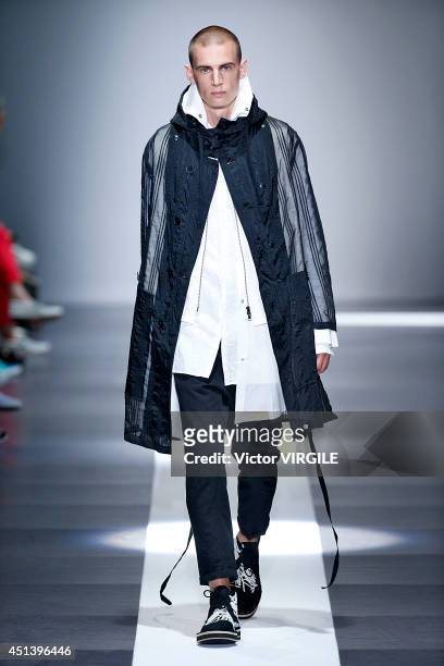 Model walks the runway during the Ann Demeulemeester show as part of the Paris Fashion Week Menswear Spring/Summer 2015 on June 27, 2014 in Paris,...