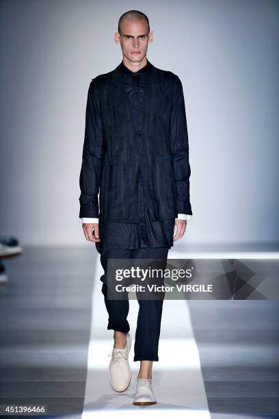 Model walks the runway during the Ann Demeulemeester show as part of the Paris Fashion Week Menswear Spring/Summer 2015 on June 27, 2014 in Paris,...